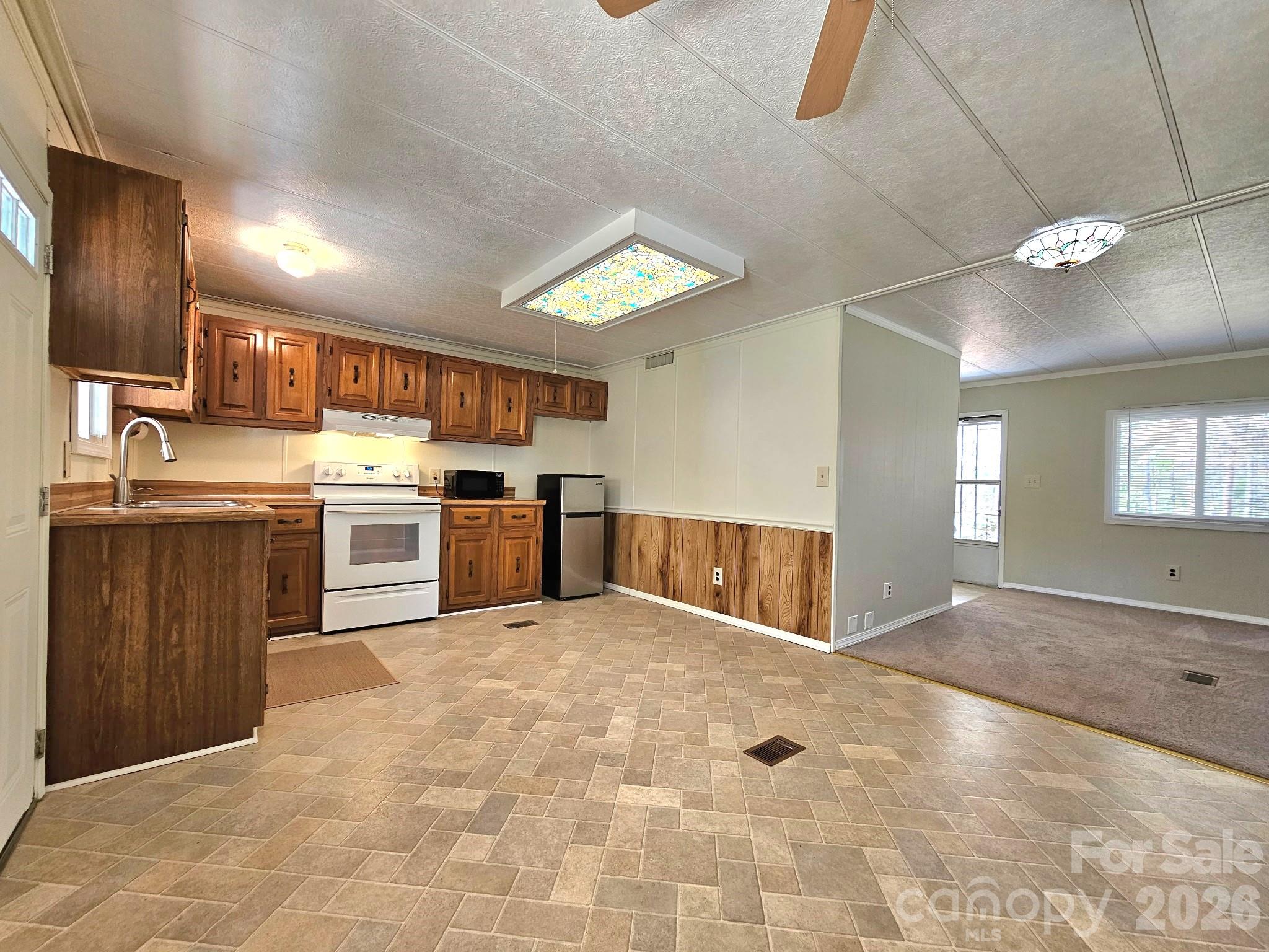 44716 Gold Branch Road Richfield, NC 28137 - Photo 13 of 47 a view of kitchen with sink window and stainless steel appliances