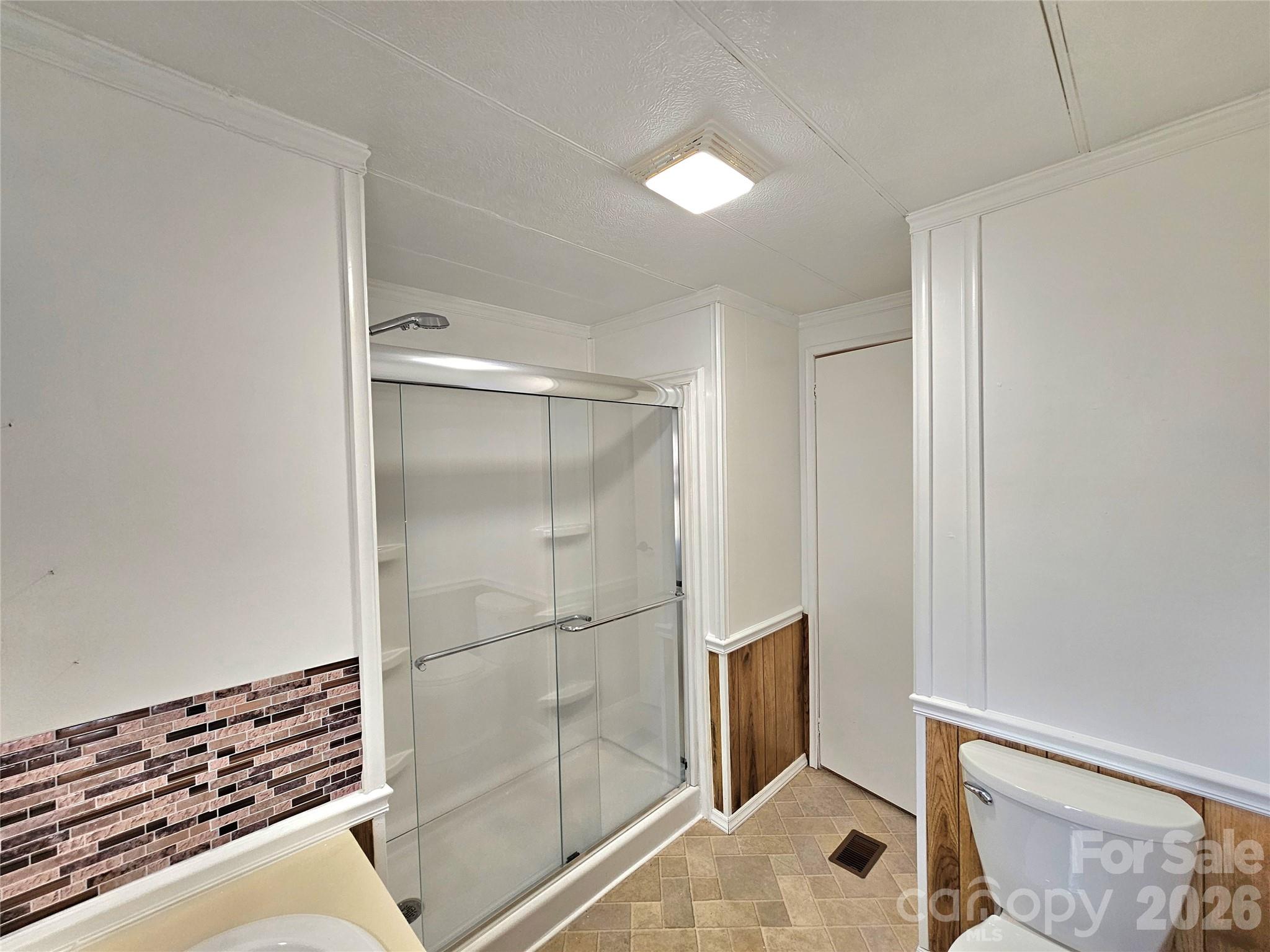 44716 Gold Branch Road Richfield, NC 28137 - Photo 18 of 47 a bathroom with a shower and a glass door