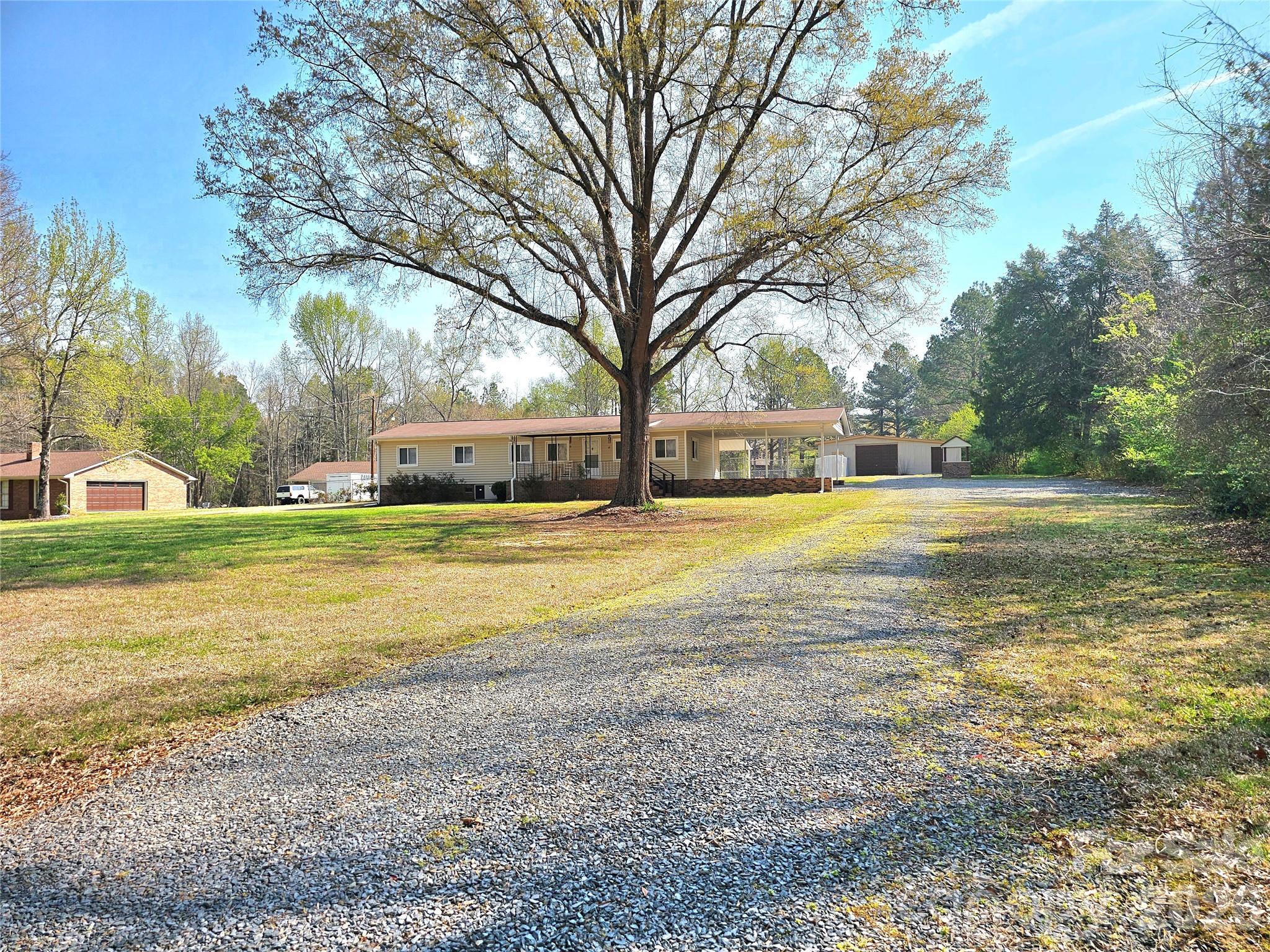 44716 Gold Branch Road Richfield, NC 28137 - Photo 2 of 47 a view of a swimming pool with an outdoor space and seating area