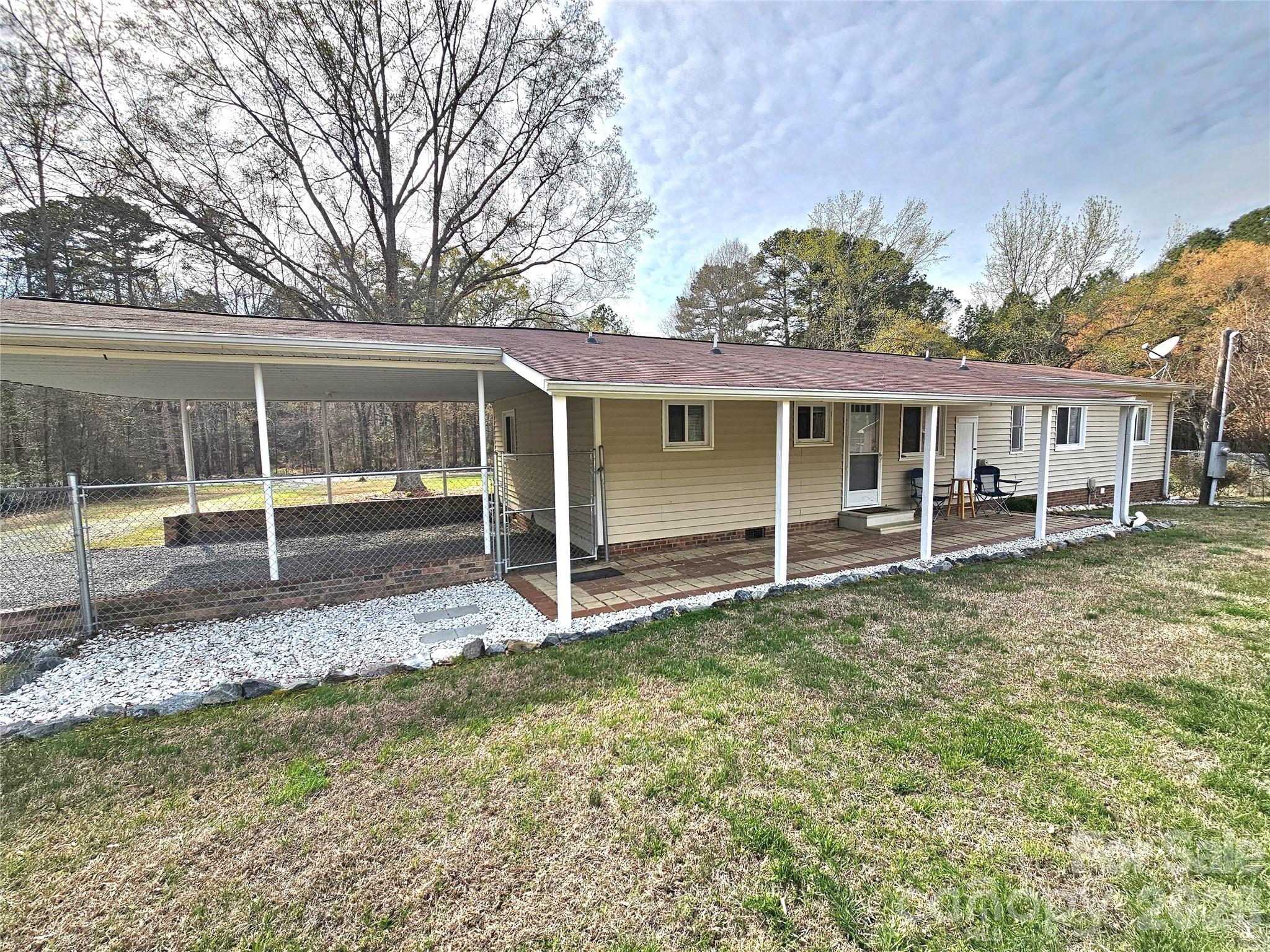 44716 Gold Branch Road Richfield, NC 28137 - Photo 42 of 47 a view of a house with backyard and chairs