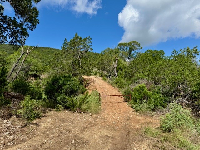 0 John Buchanan Road Leakey, TX 78873 - Photo 4 of 17 a yard with a house