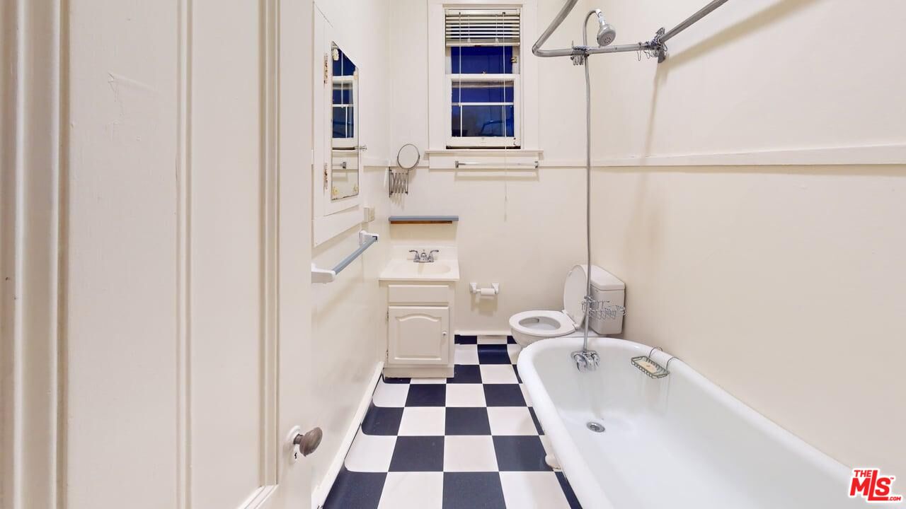 487 43rd Street, Unit 3 Oakland, CA 94609 - Photo 6 of 9 a bathroom with a sink a toilet and a shower