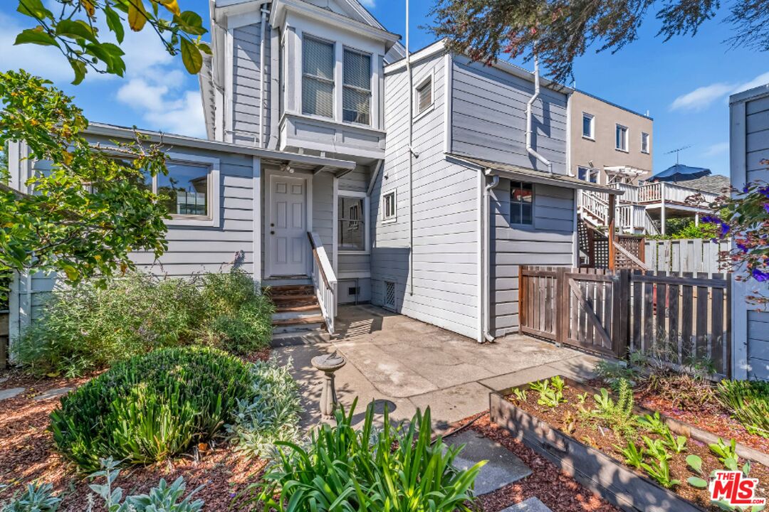 487 43rd Street, Unit 3 Oakland, CA 94609 - Photo 9 of 9 a view of a chair and table in the backyard