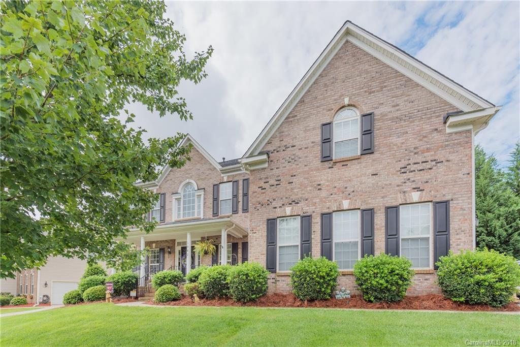 1942 Faison Avenue, Unit 161 Fort Mill, SC 29708 - Photo 1 of 21 a front view of a house with garden
