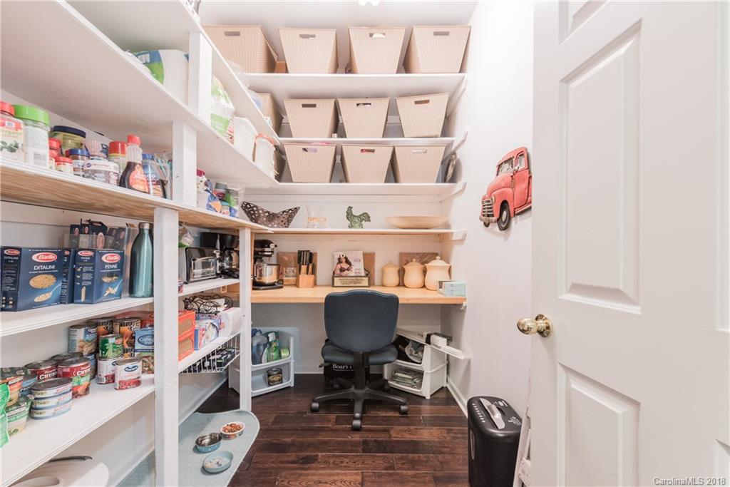 1942 Faison Avenue, Unit 161 Fort Mill, SC 29708 - Photo 11 of 21 a living room with furniture and a book shelf