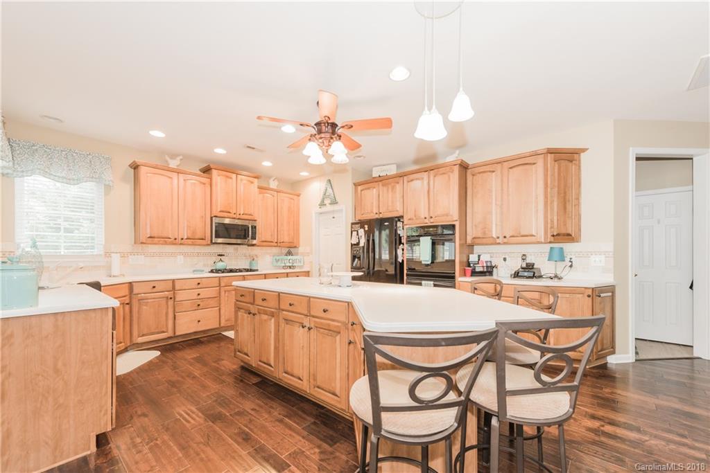 1942 Faison Avenue, Unit 161 Fort Mill, SC 29708 - Photo 8 of 21 a large kitchen with a table and chairs