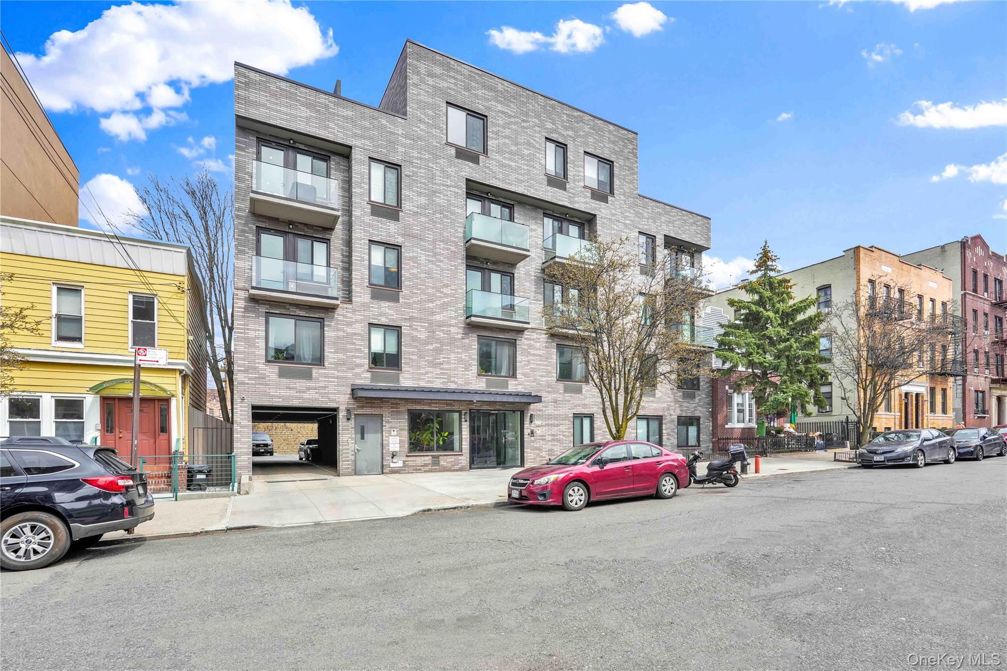23-43 31st Road, Unit 3B Queens, NY 11106 - Photo 13 of 15 a car parked in front of a building