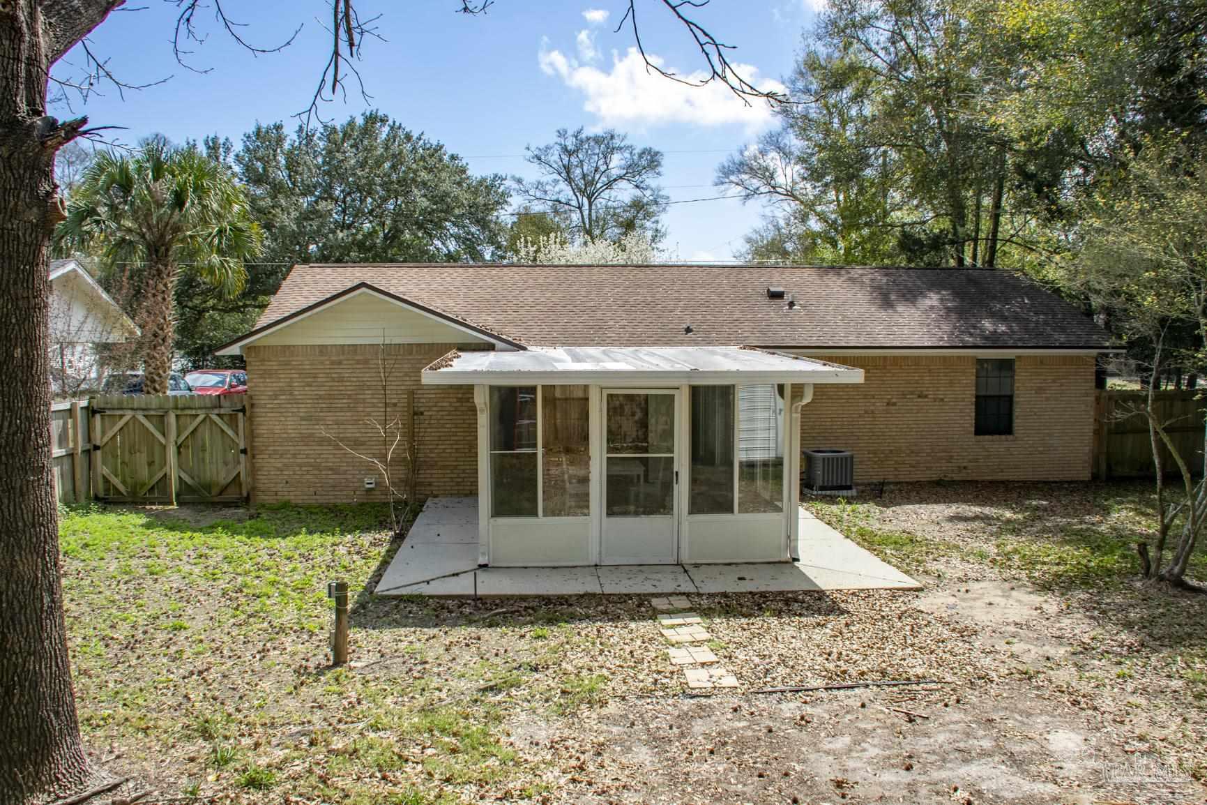 6514 Oakcrest Road Milton, FL 32570 - Photo 11 of 68 a view of a house with a yard