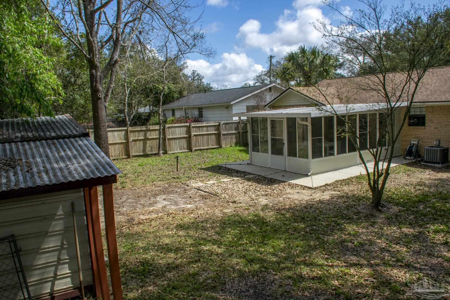 6514 Oakcrest Road Milton, FL 32570 - Photo 15 of 68 a view of a house with a yard
