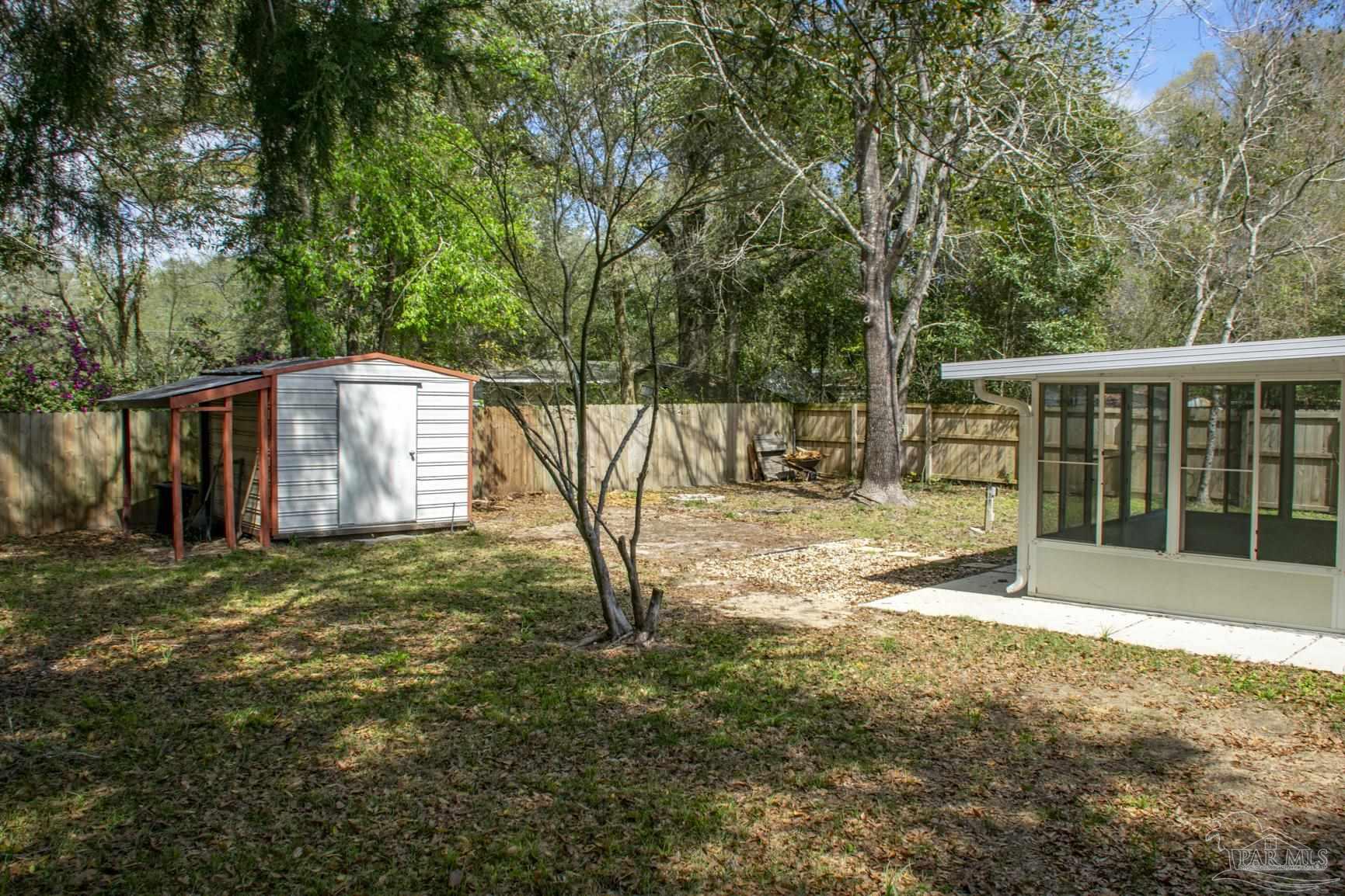 6514 Oakcrest Road Milton, FL 32570 - Photo 16 of 68 a view of backyard with green space