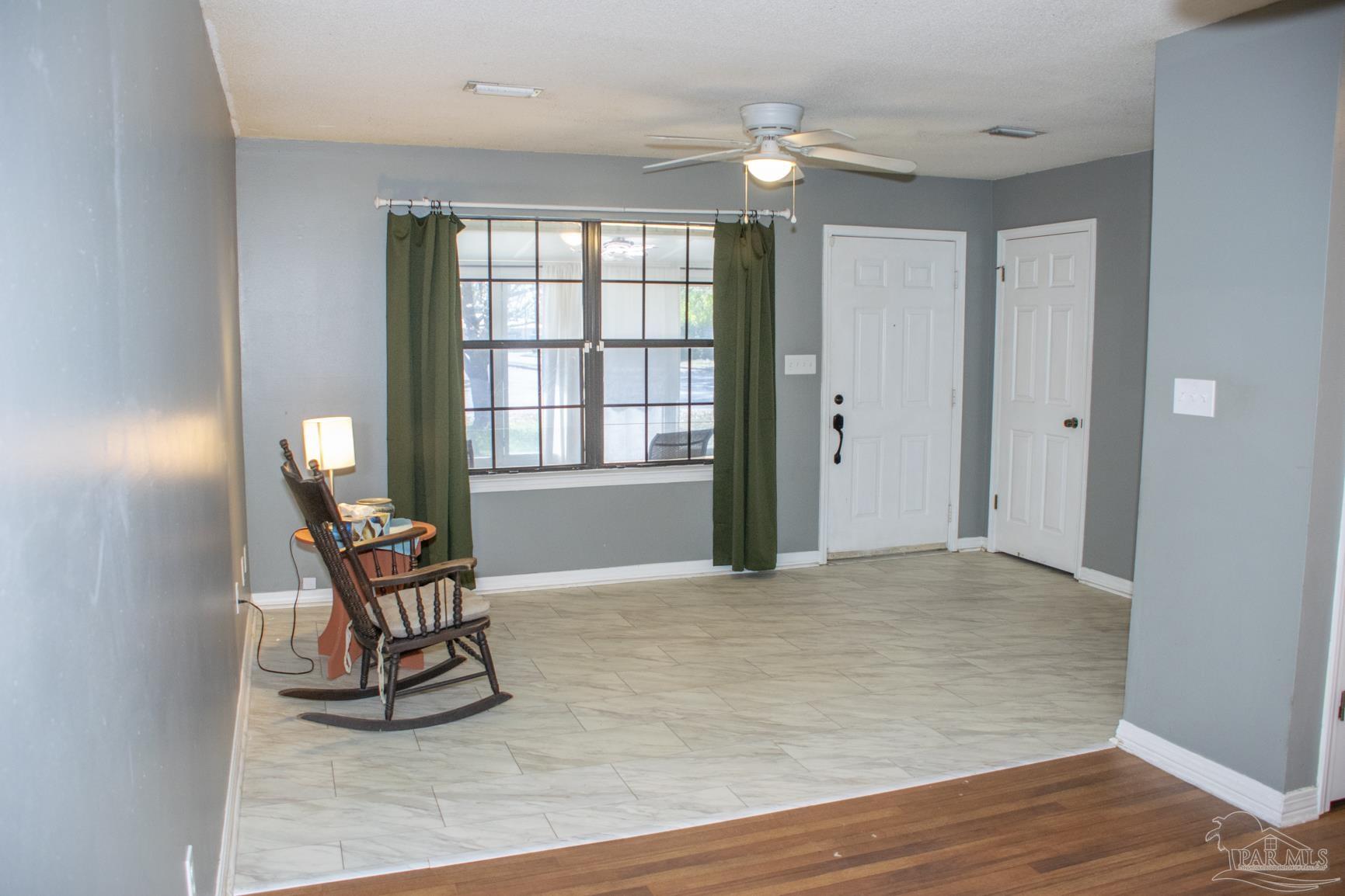 6514 Oakcrest Road Milton, FL 32570 - Photo 22 of 68 a view of a livingroom with furniture and a window