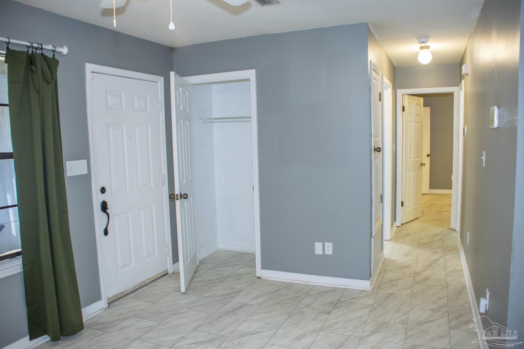 6514 Oakcrest Road Milton, FL 32570 - Photo 25 of 68 an empty room with closet and a bathroom