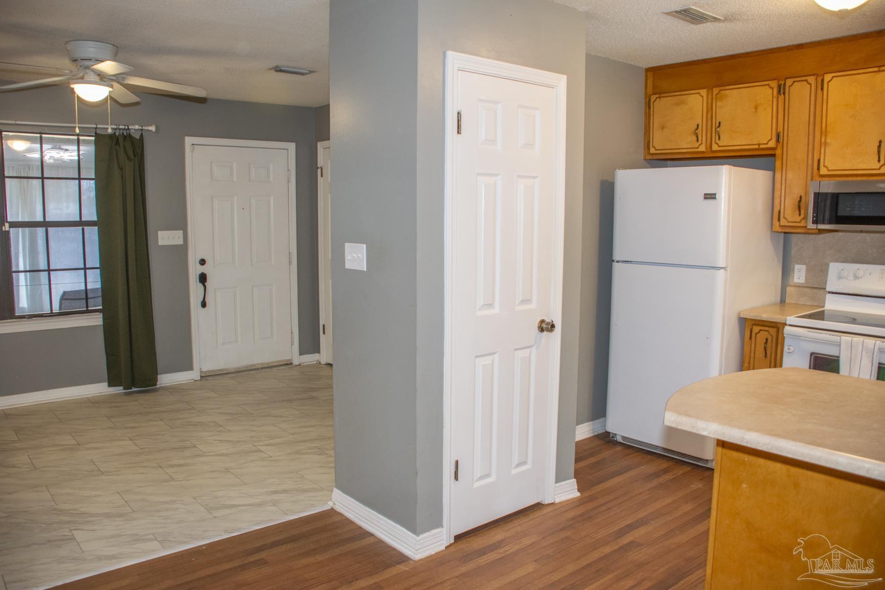 6514 Oakcrest Road Milton, FL 32570 - Photo 28 of 68 a view of a kitchen with wooden floor and a sink