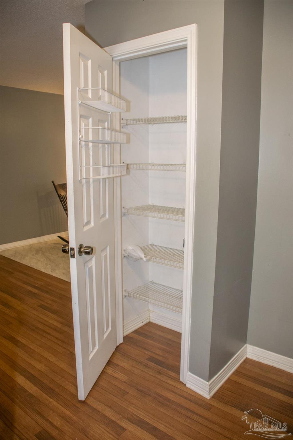 6514 Oakcrest Road Milton, FL 32570 - Photo 31 of 68 a view of a room with wooden floor