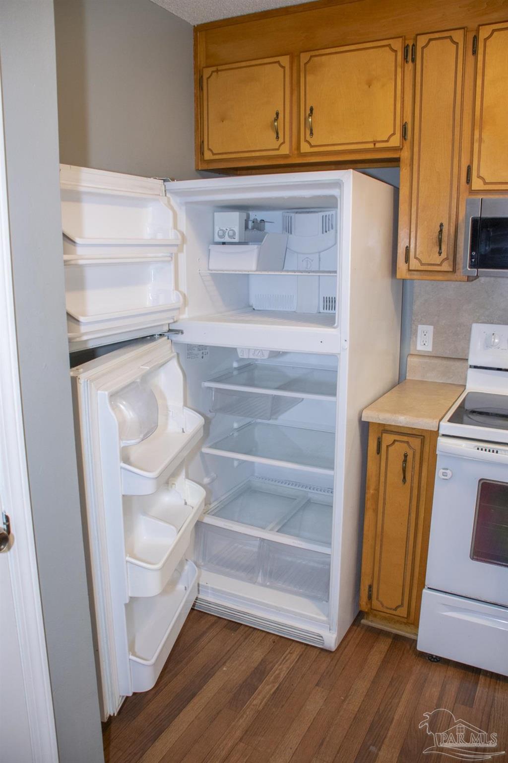 6514 Oakcrest Road Milton, FL 32570 - Photo 32 of 68 a view of walk in closet with empty racks