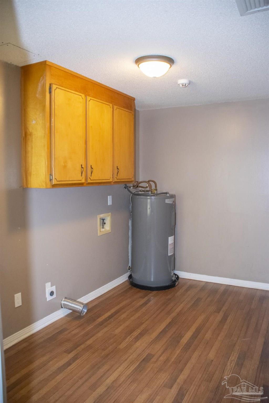 6514 Oakcrest Road Milton, FL 32570 - Photo 36 of 68 a room with wooden floor and a window