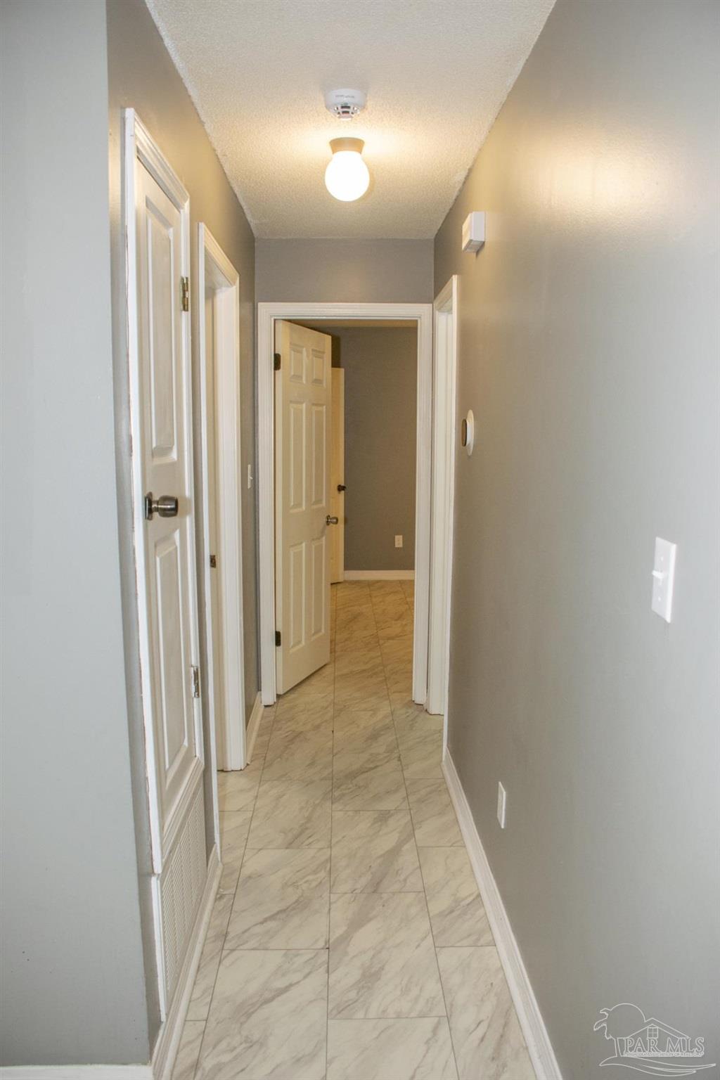 6514 Oakcrest Road Milton, FL 32570 - Photo 40 of 68 a view of a hallway