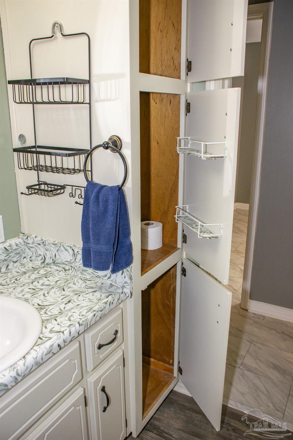 6514 Oakcrest Road Milton, FL 32570 - Photo 46 of 68 a bathroom with a granite countertop sink and a mirror