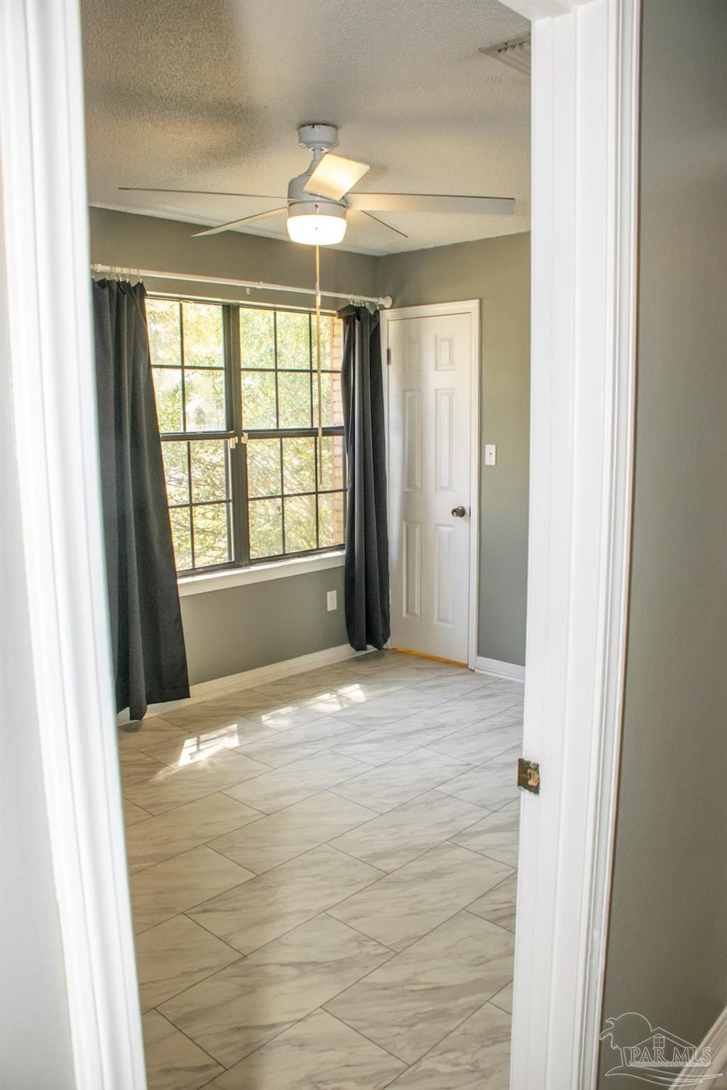 6514 Oakcrest Road Milton, FL 32570 - Photo 53 of 68 a view of an empty room with a window