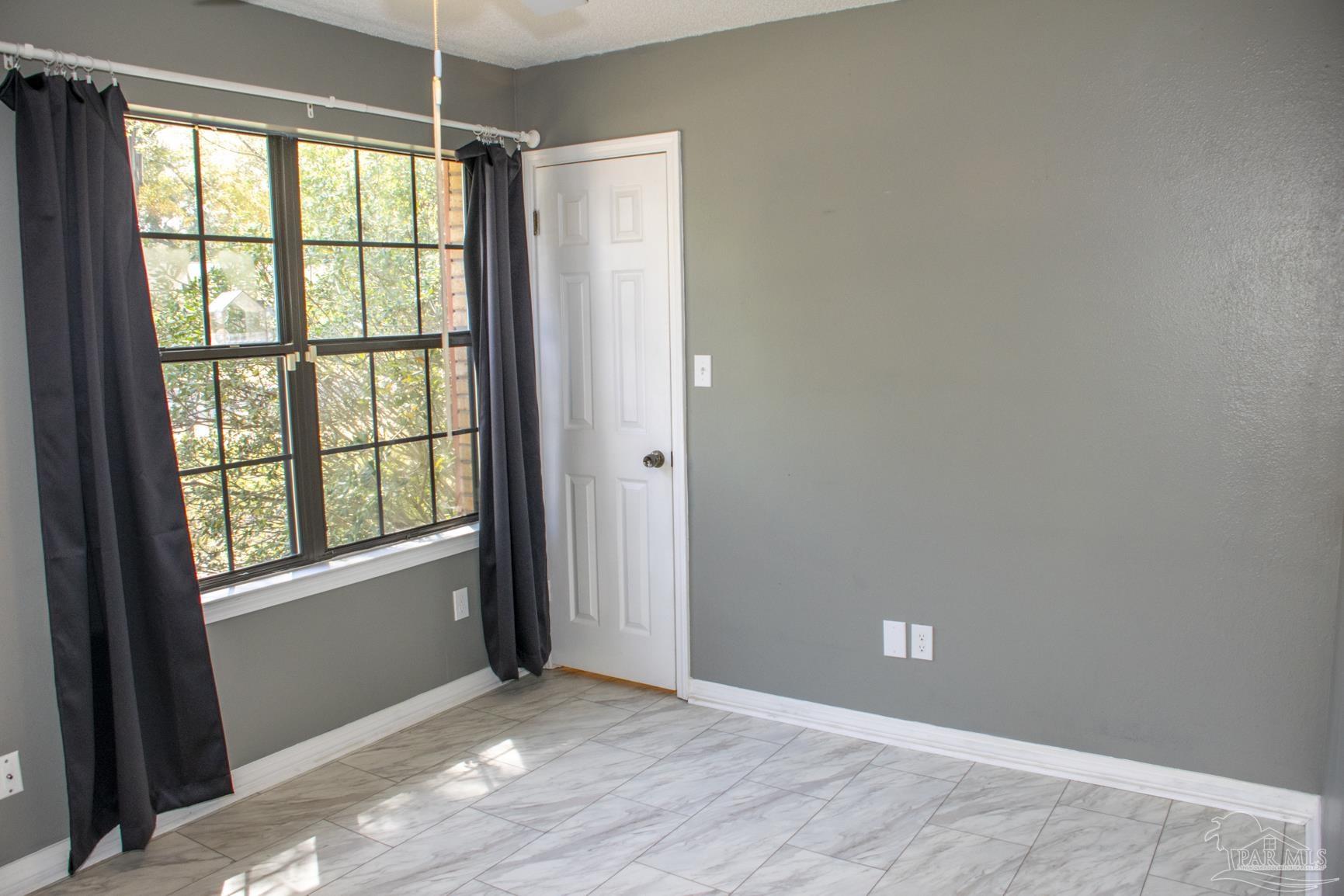 6514 Oakcrest Road Milton, FL 32570 - Photo 54 of 68 a view of an empty room with a window