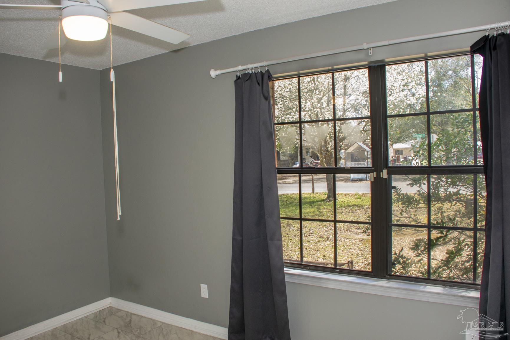 6514 Oakcrest Road Milton, FL 32570 - Photo 56 of 68 a view of an empty room and window