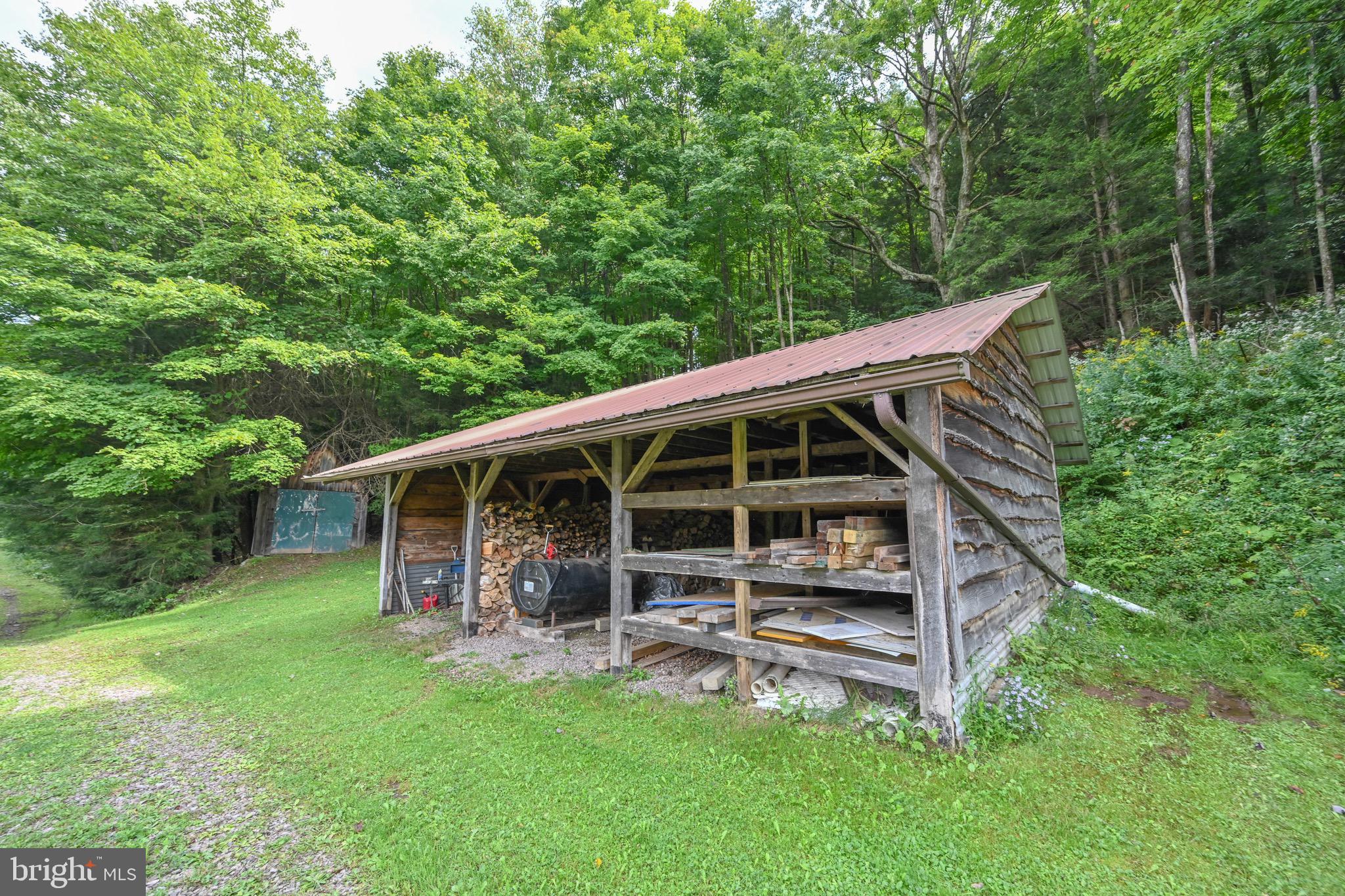 2527 Pigs Ear Road Grantsville, MD 21536 - Photo 67 of 94 a view of a backyard with wooden fence and large trees