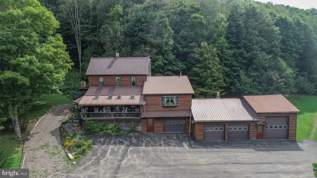 a living room with patio furniture and a floor to ceiling window