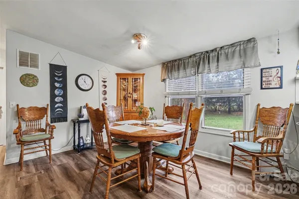 a dining room with furniture and window