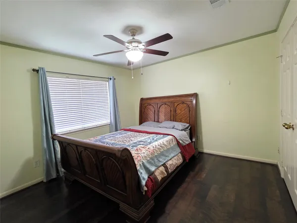 a bedroom with a bed and window