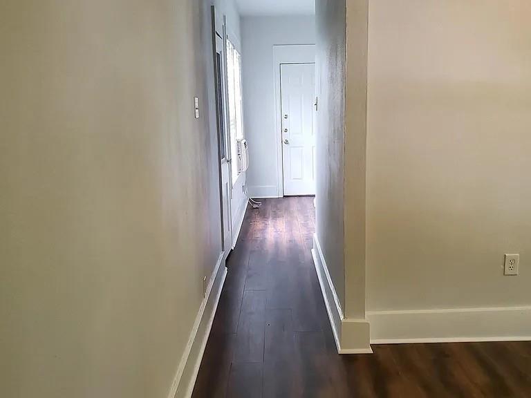 304 Fulton Street, Unit B Denton, TX 76201 - Photo 5 of 10 Corridor featuring baseboards and dark wood-type flooring
