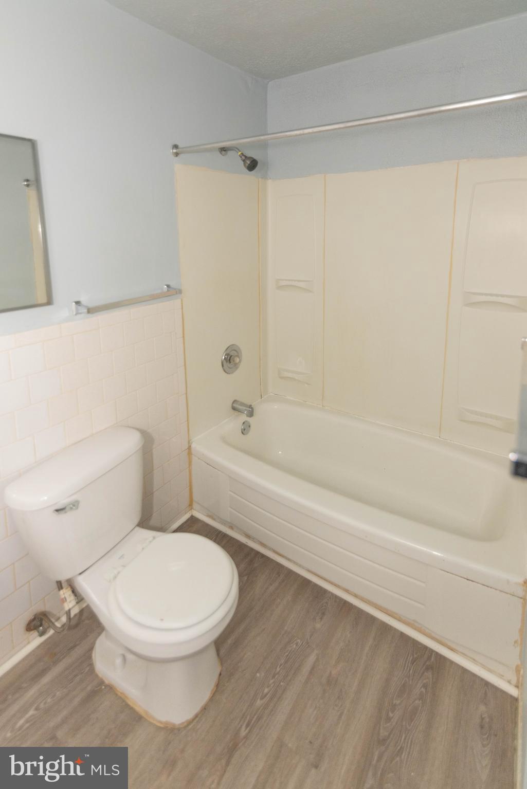 3712 Mayberry Avenue, Unit E Baltimore, MD 21206 - Photo 9 of 22 a white toilet sitting next to a bath tub