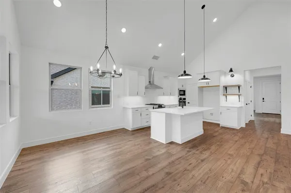 a view of a room with a ceiling fan