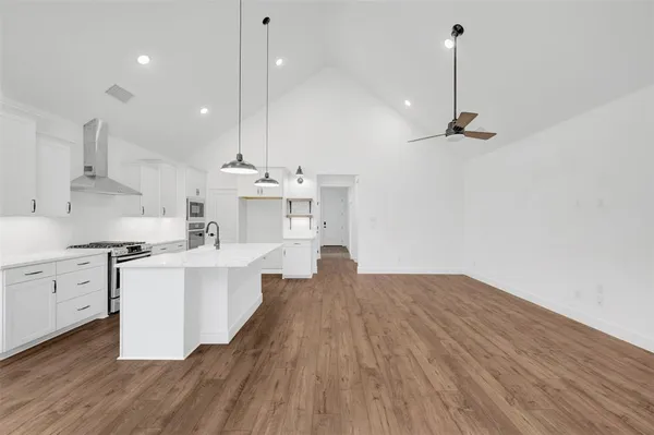 a view of a room with wooden floor and light wood