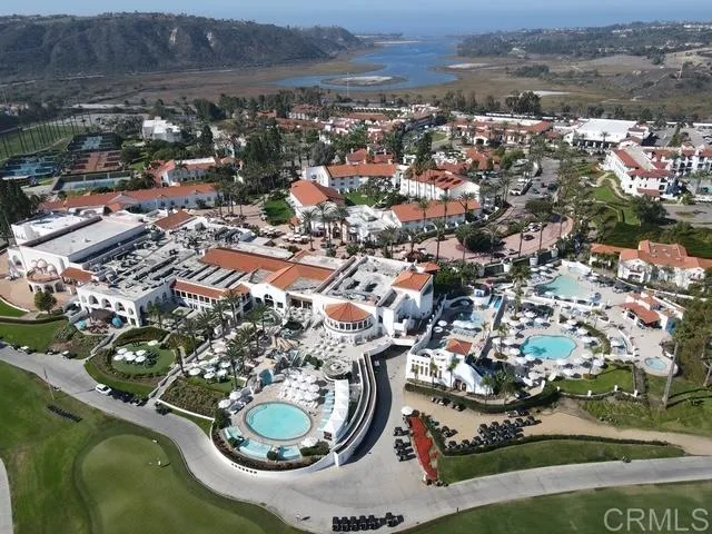 an aerial view of a house with a lake view