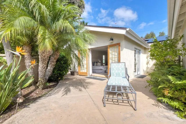 a view of a pathway of the house with a yard