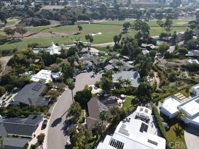 an aerial view of a houses with a lake view