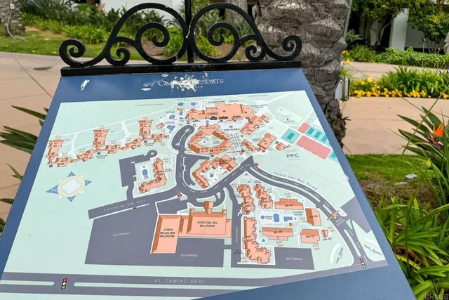 an aerial view of a house swimming pool and a yard