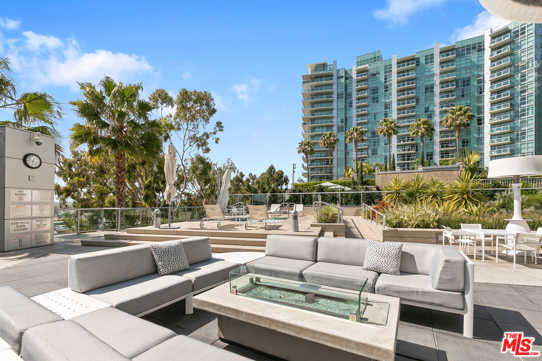 13600 Marina Pointe Drive, Unit 401 Marina del Rey, CA 90292 - Photo 23 of 41 a view of a patio with couches and potted plants