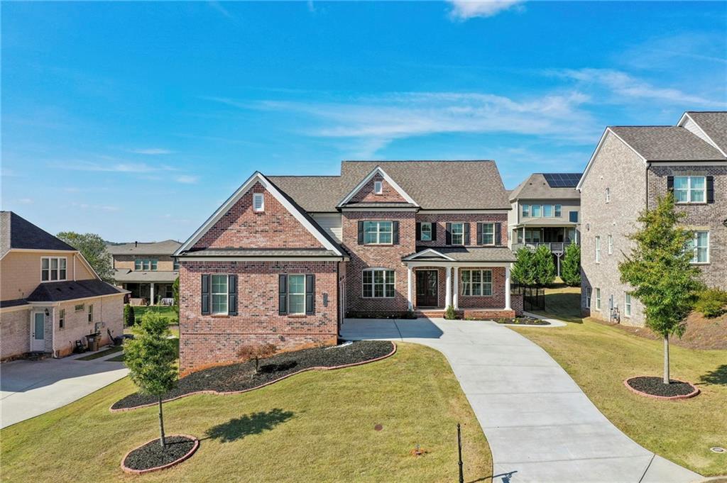 a front view of a house with a yard