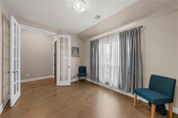 a view of a livingroom with furniture and a window