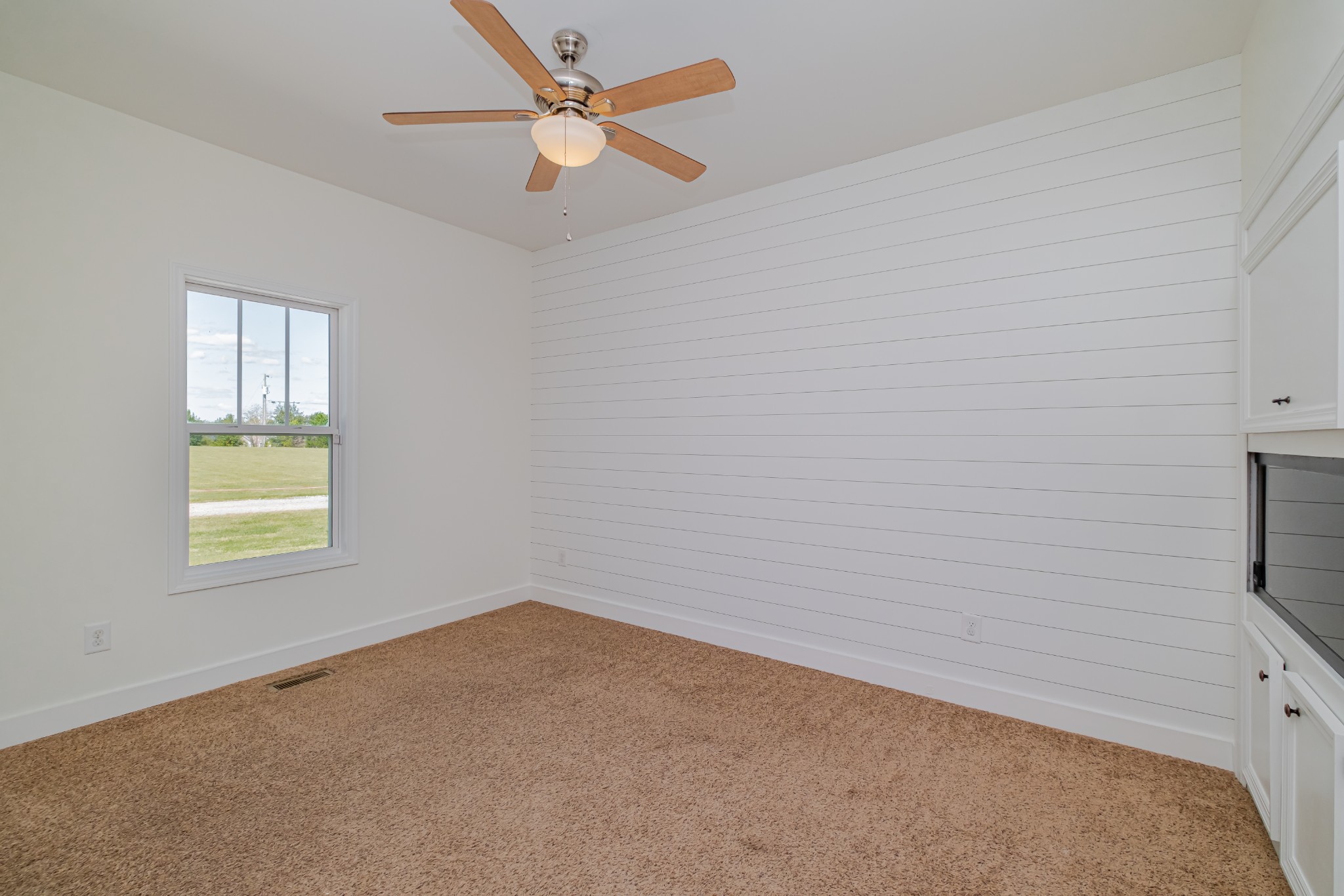 4781 Brookhollow Road Chapel Hill, TN 37034 - Photo 35 of 57 an empty room with a window and a ceiling fan