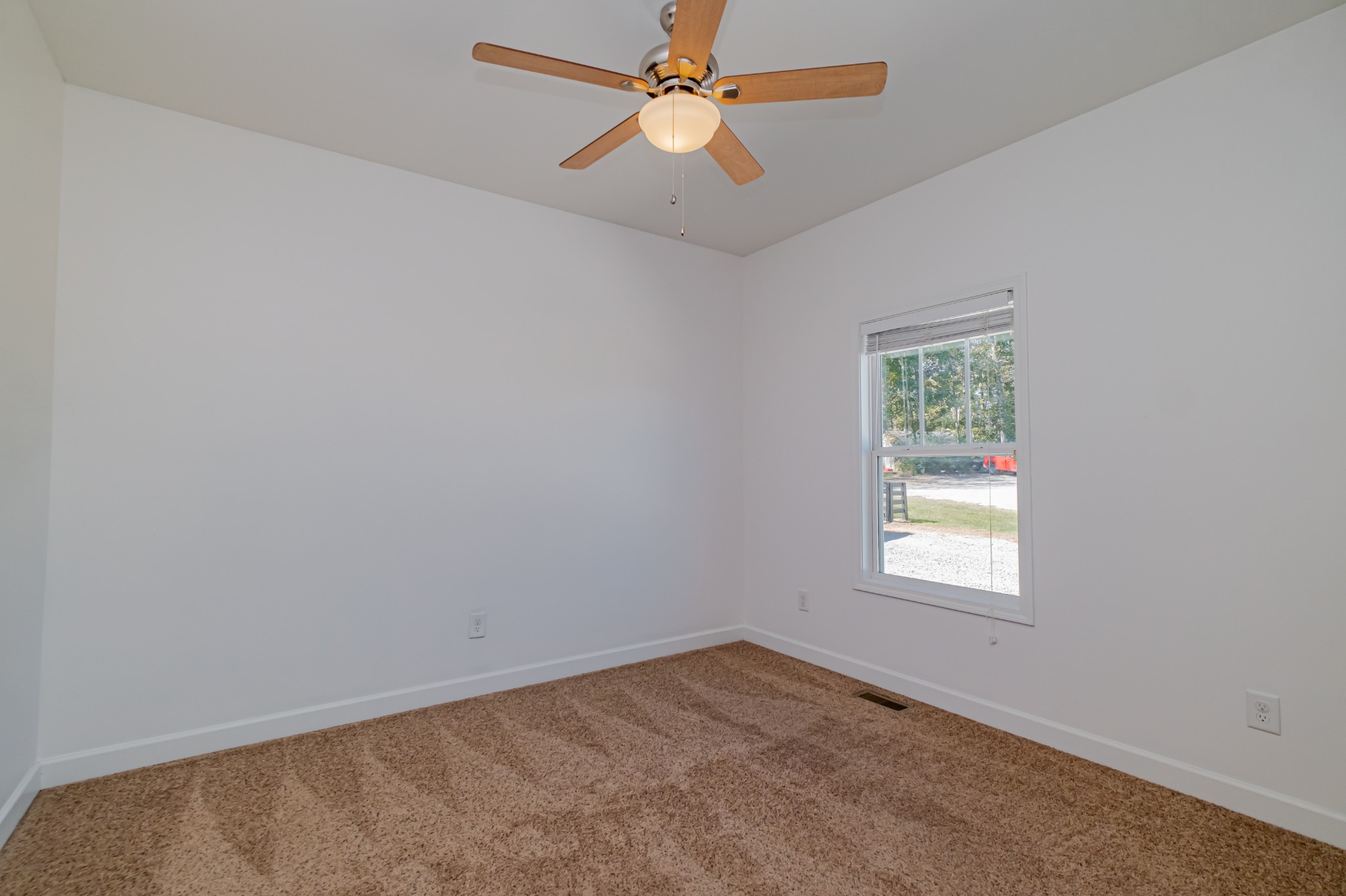 4781 Brookhollow Road Chapel Hill, TN 37034 - Photo 36 of 57 an empty room with a window and a fan