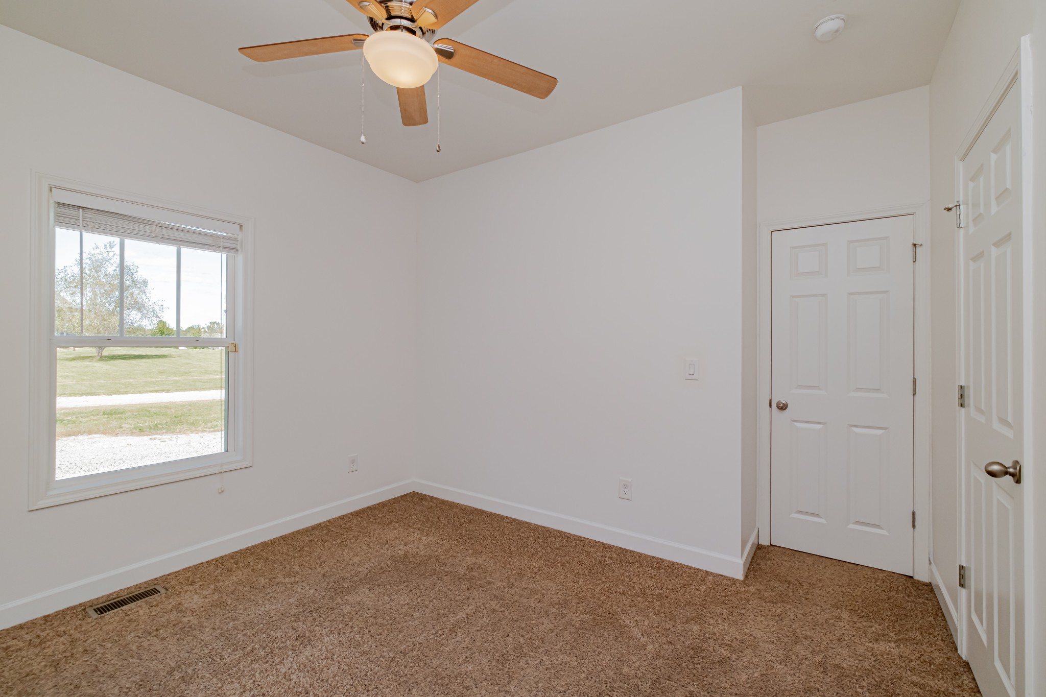 4781 Brookhollow Road Chapel Hill, TN 37034 - Photo 39 of 57 an empty room with a window and a fan
