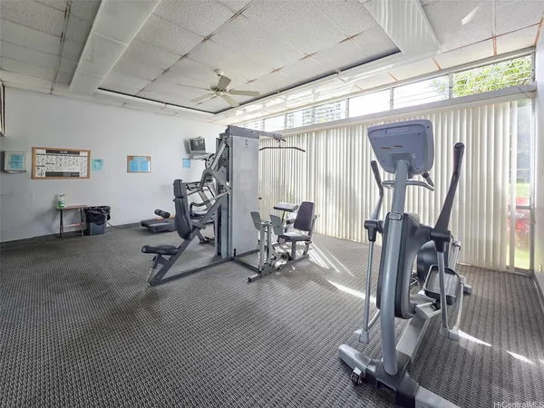 a swimming pool with outdoor seating and yard