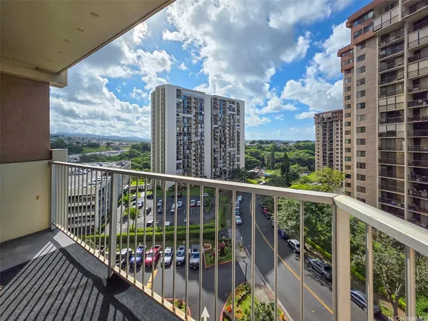 a view of a balcony with wooden floor