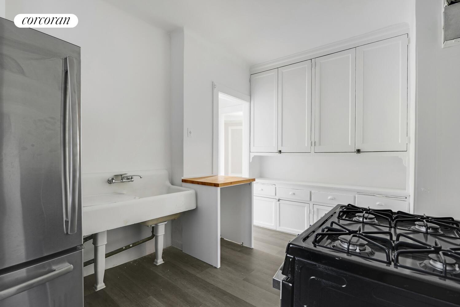 409 Edgecombe Avenue, Unit 2A Manhattan, NY 10032 - Photo 10 of 19 a kitchen with a stove and a window