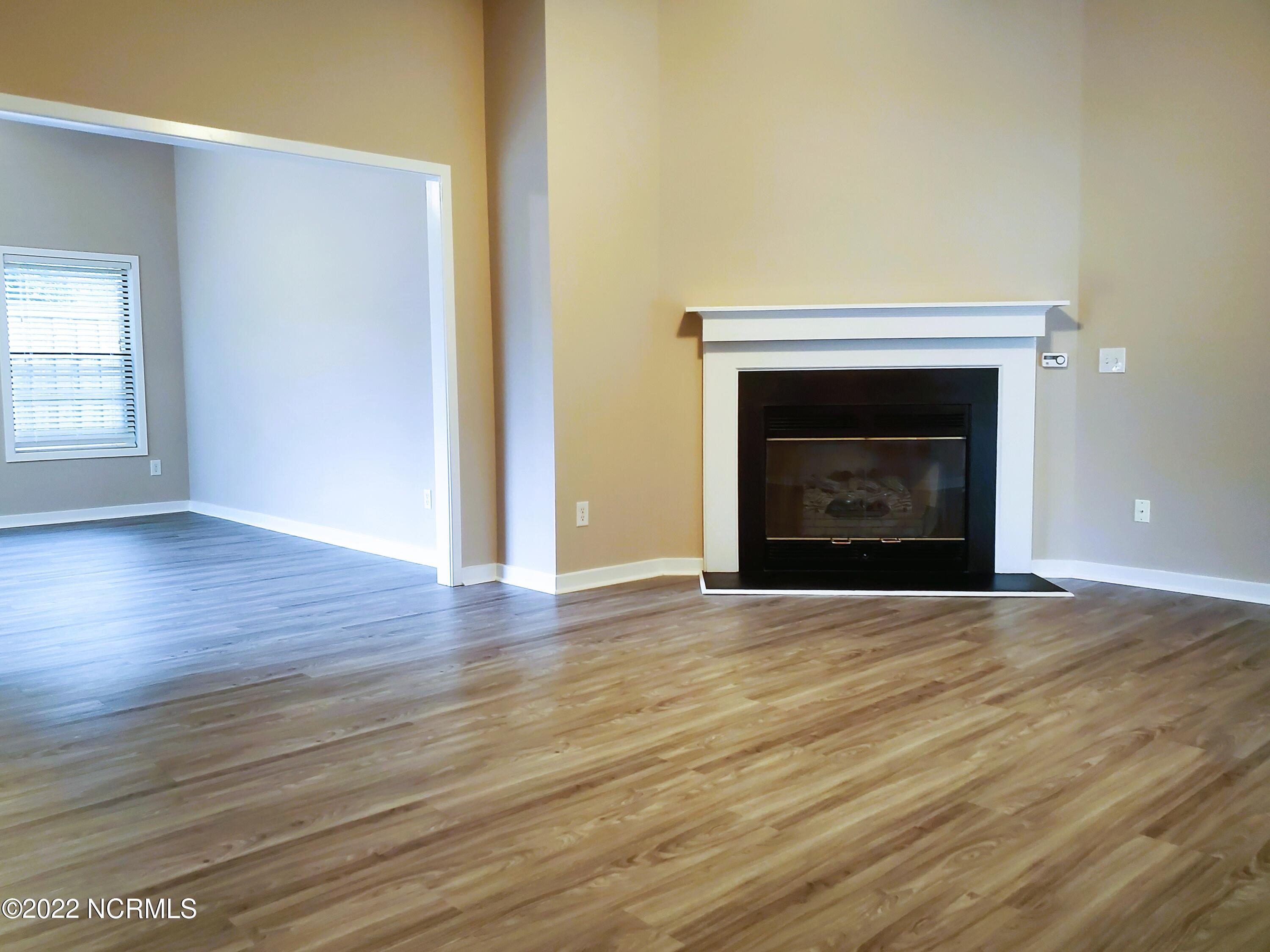 7212 Trailmark Road Wilmington, NC 28405 - Photo 4 of 24 Fireplace and Sunroom