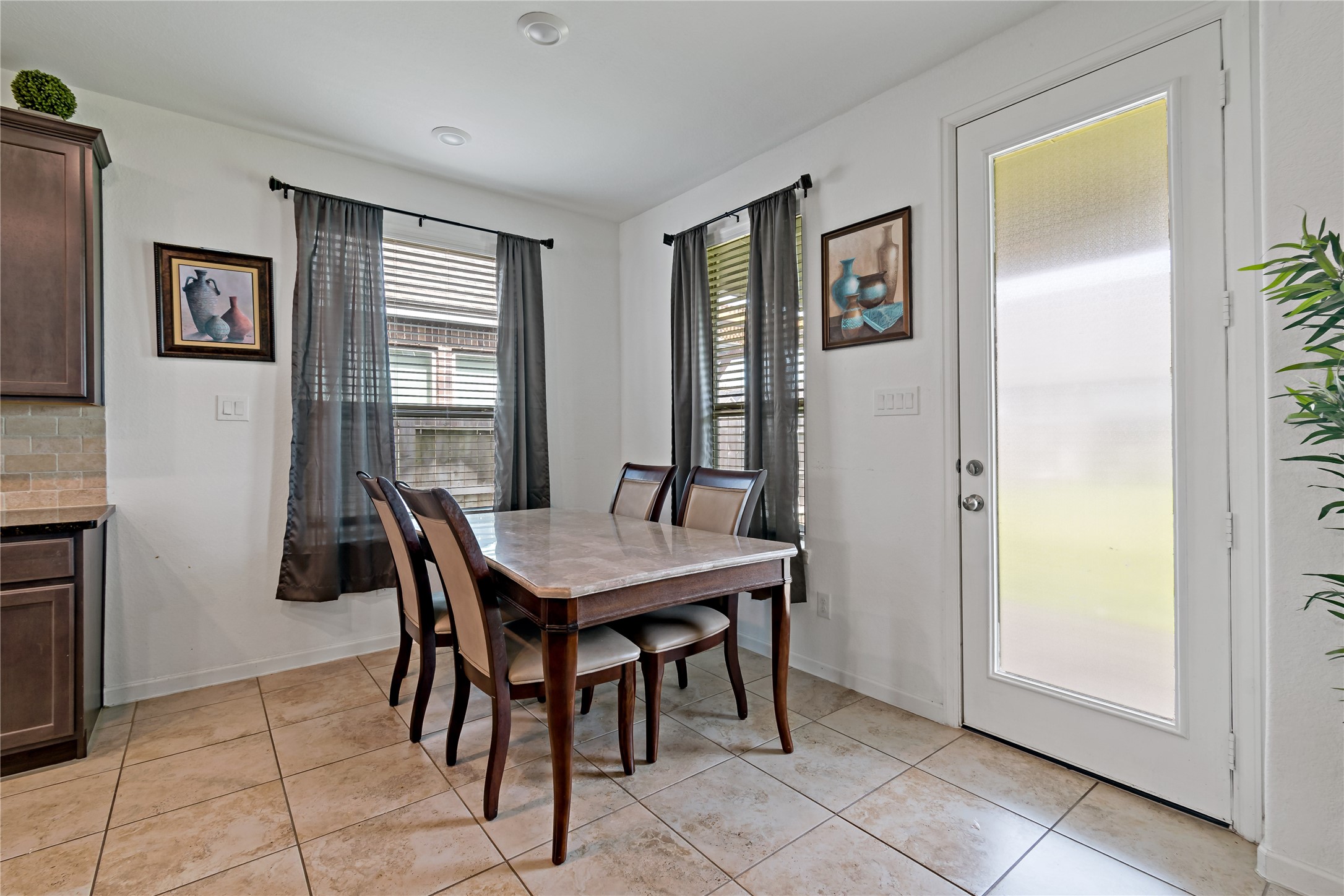 14010 Hartford Heights Way Rosharon, TX 77583 - Photo 11 of 30 a view of a dining room with furniture and window
