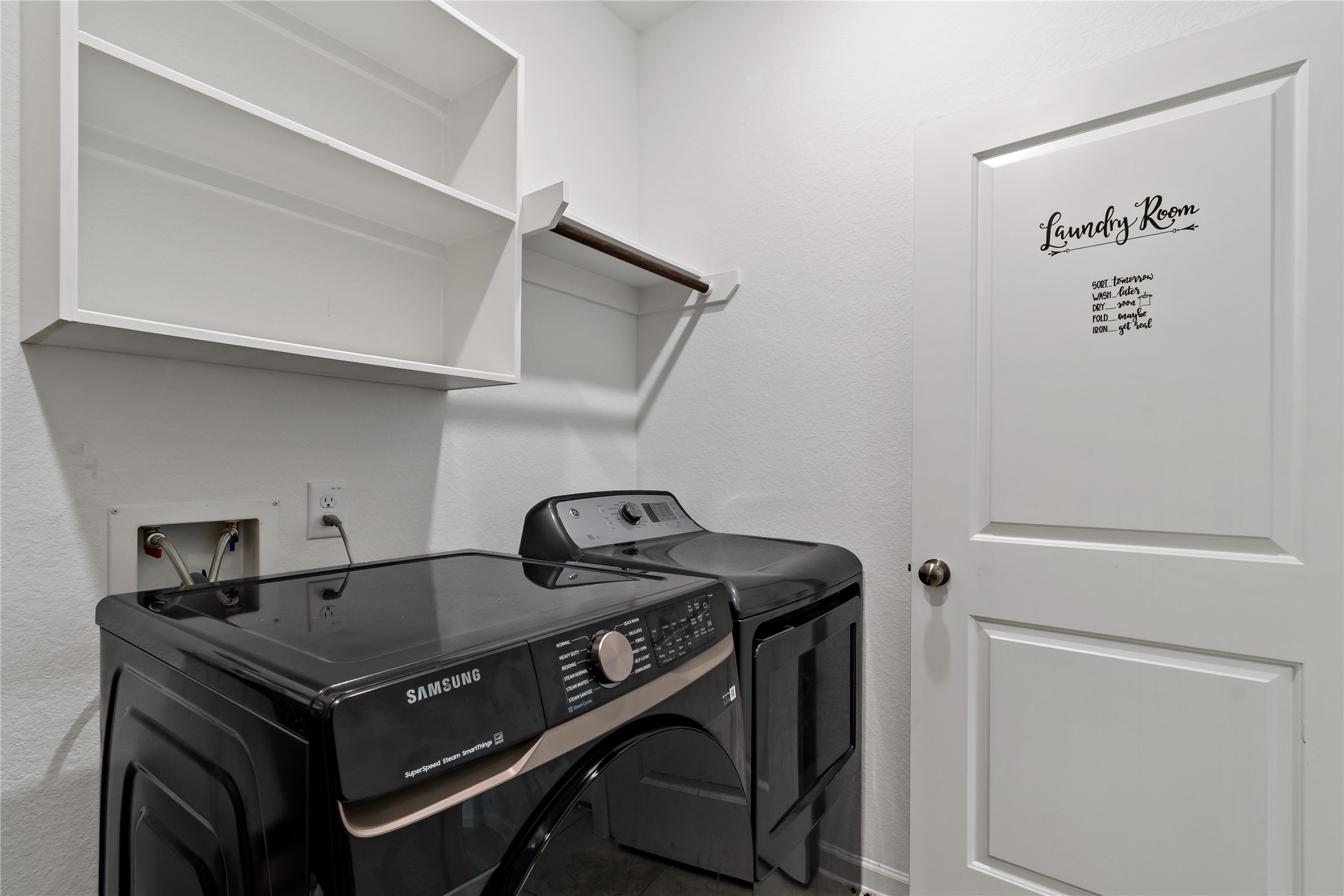 14010 Hartford Heights Way Rosharon, TX 77583 - Photo 28 of 30 a utility room with dryer and washer
