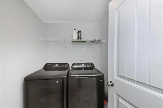 a bathroom with a granite countertop sink a toilet and a shower